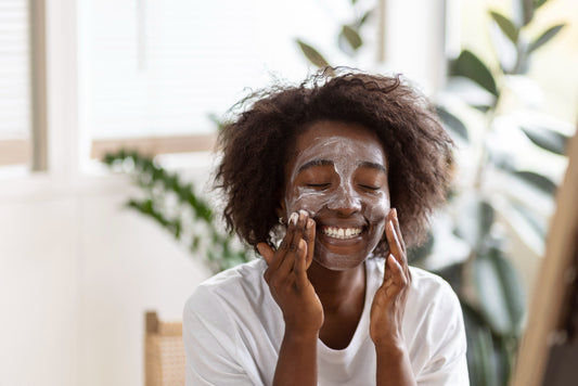 Beautiful young lady applying a product containing NMF and Humectants on her face